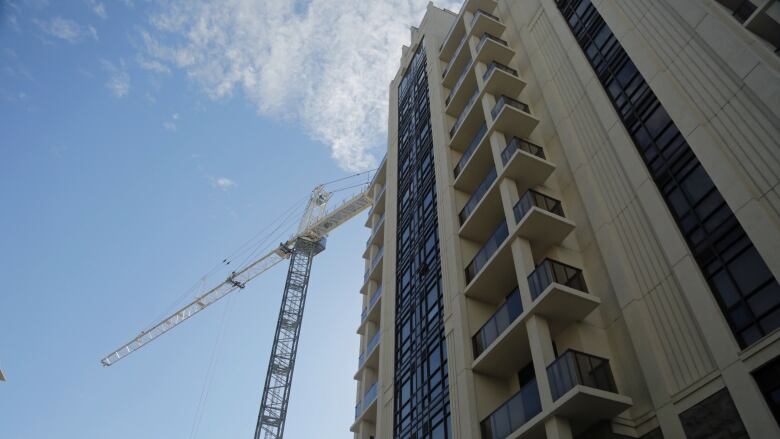 A crane is up at the site of City Square condos in Durand, where Jeff Paikin's company New Horizon Development Group is building the project's third phase.