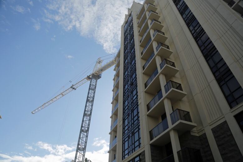 A crane is up at the site of City Square condos in Durand, where Jeff Paikin's company New Horizon Development Group is building the project's third phase.