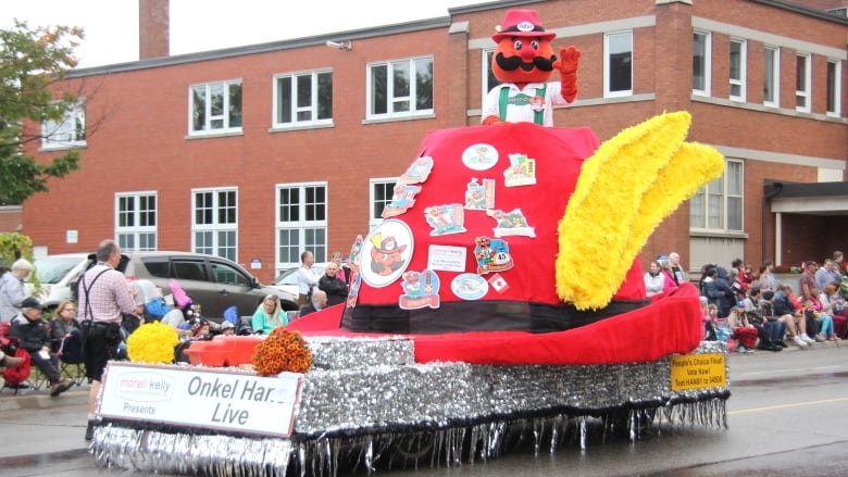 A parade float of a giant Alpine hat