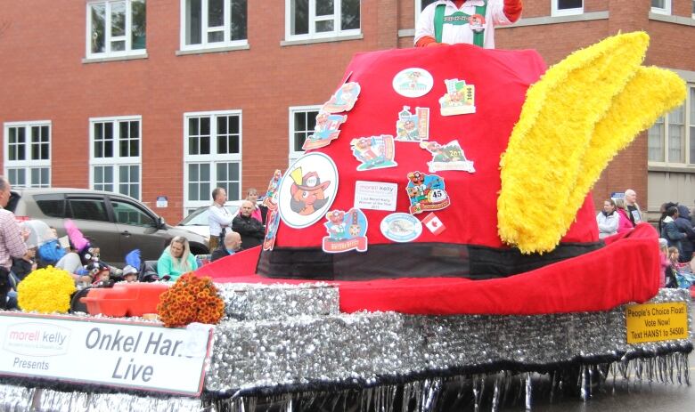 A parade float of a giant Alpine hat