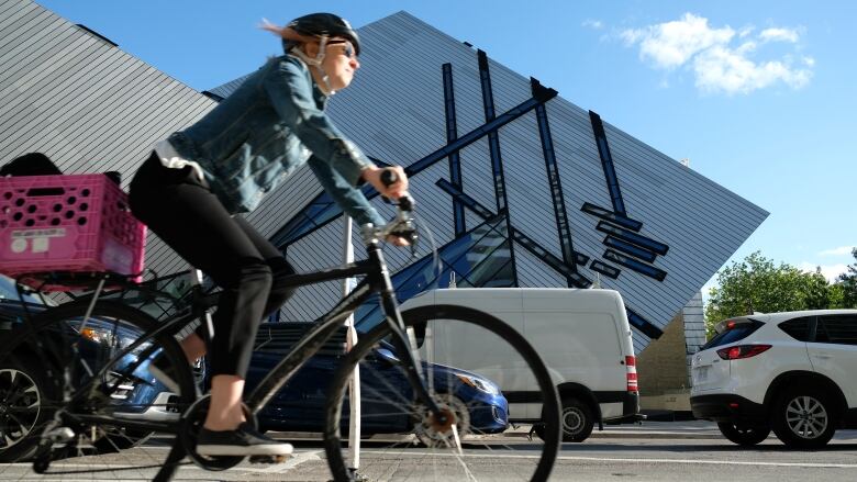 A cyclist rides in a bike lane.