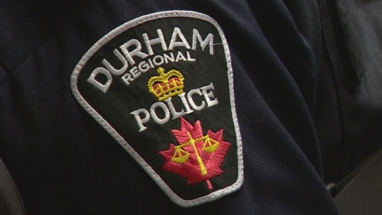 A Durham regional Police uniform badge.