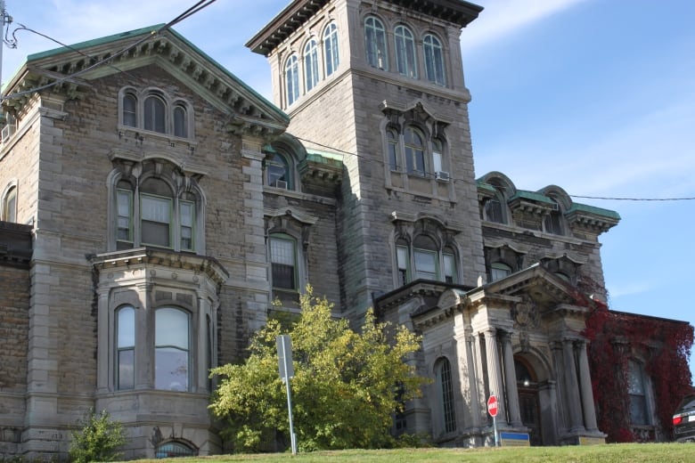 Victorian greystone seen from below.