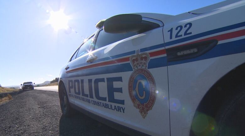 A police vehicle parked on a road.