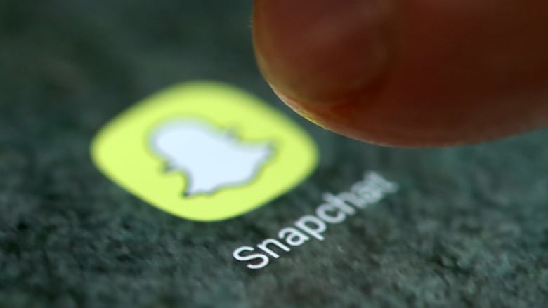 The Snapchat app logo is seen on a smartphone in this picture illustration taken September 15, 2017. 