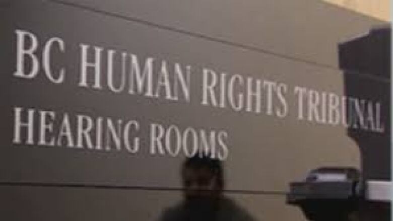 A sign with the words B.C. Human Rights Tribunal.