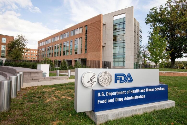 Sign that says FDA in front of a brown building. 