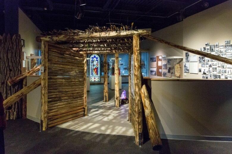 An art exhibit room with a wooden entranceway.