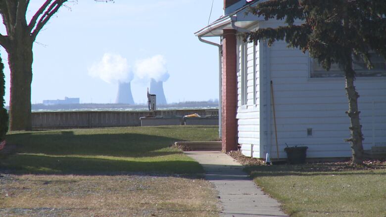 Stacks from the Fermi 2 nuclear power plant in Michigan sit in the view of people living in Amherst Pointe.