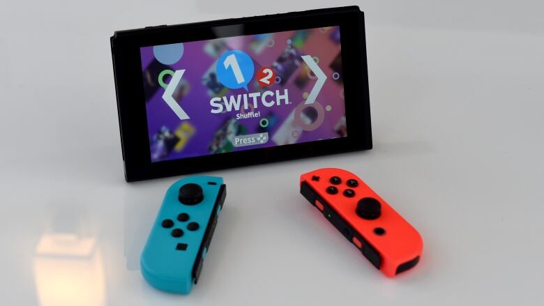 A Nintendo Switch is displayed on a table.