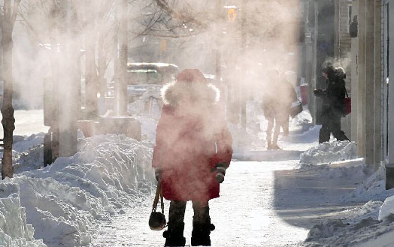 A person walks through Winnipeg on a chilly day.