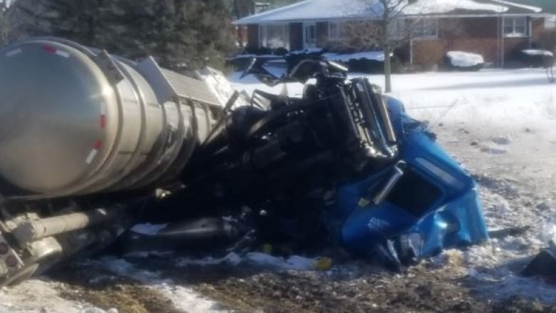 What appears to be an overturned semi-truck and trailer.