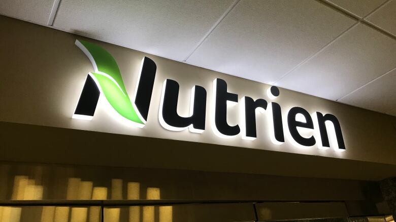 A Nutrien sign from inside a building