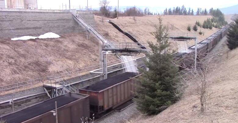 An image of rail cars with coal in them.