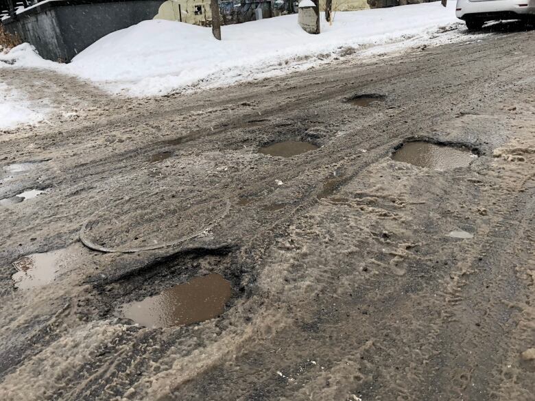 Potholes at the intersection of Somerset Street West and Bay Street in Ottawa in February 2018.