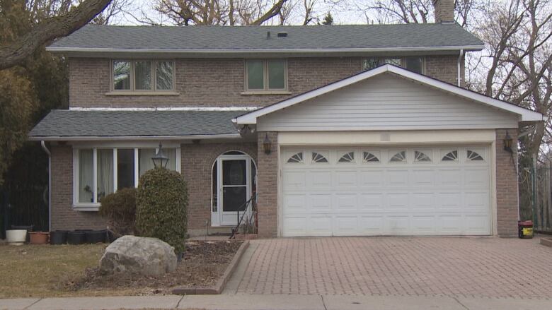 Fully-detached house with a double car garage.