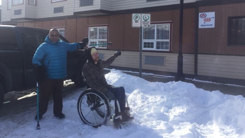 Darryl Tait and Ramesh Ferris see accessible parking spots filled with snow just like this one all over Whitehorse throughout the winter. 