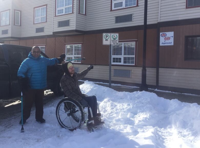 Darryl Tait and Ramesh Ferris see accessible parking spots filled with snow just like this one all over Whitehorse throughout the winter. 