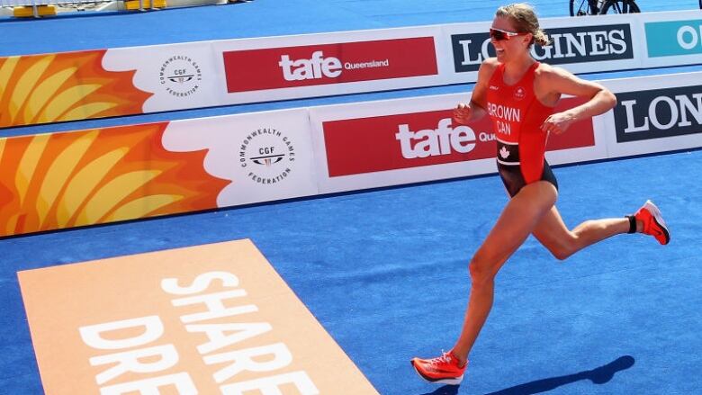 Canada's Joanna Brown races to the line to win bronze in the women's triathlon on Day One of the Gold Coast 2018 Commonwealth Games. 