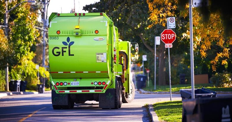 A green truck with the words 'GFL' on it.