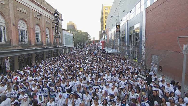 Winnipeg Jets fans fill a downtown street during a whiteout party in 2018.