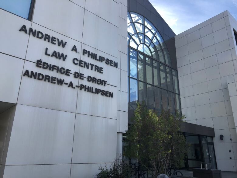 An exterior shot of a large institutional building with the words 'Andrew A Philipsen Law Centre' written on the side.