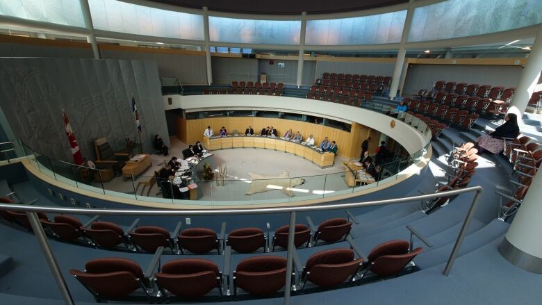 A large circular room with seats.