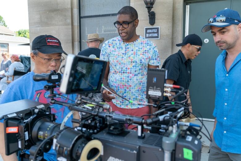 Canadian film and TV director Sudz Sutherland is seen in Toronto directing a production crew on the set of the CBC-TV series Frankie Drake in June 2018. 