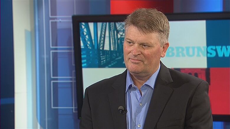 A man standing in front of a CBC New Brunswick TV