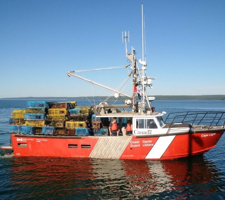 A red-and-white boat labelled 