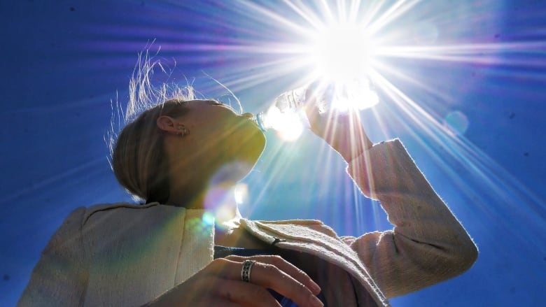 A person drinking water.