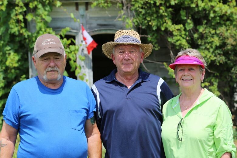 Peter Anderson, pictured in the middle is the owner of the property. His wife, Joan, is pictured right and Harold Haines, the neighbour who watches over the property is on the left. 