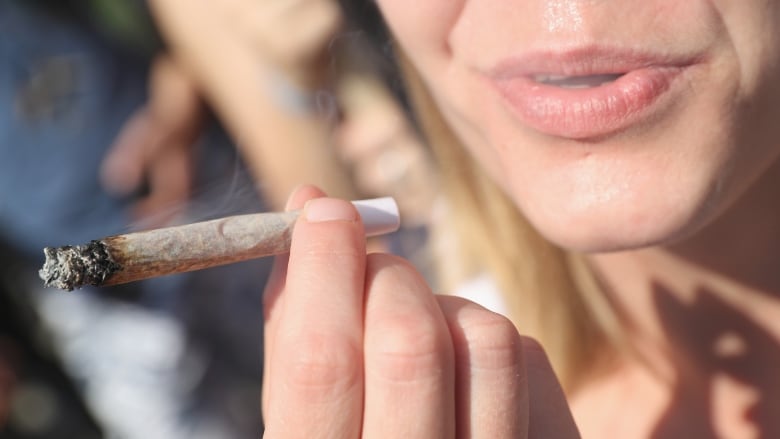 A woman smoking a joint 