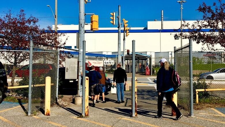 Employees enter the Chrysler assembly plant in Windsor.