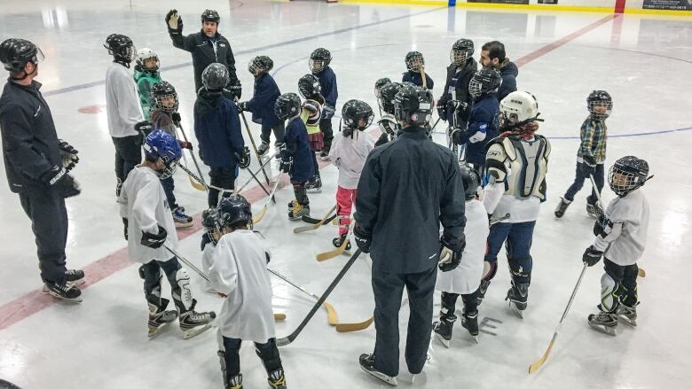 A group of young hockey players on the ice