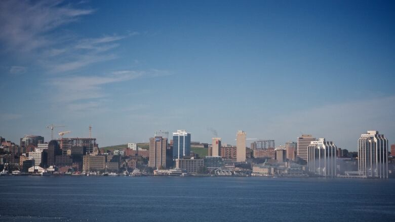 A row of high-rise buildings along the ocean.