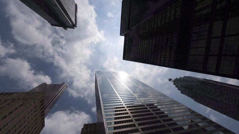 A view of highrise office towers taken from the ground up.