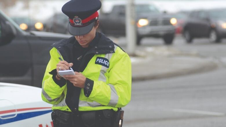 A London police officer on duty in the city. The Thames Valley District School Board will decide in early 2024 if school resource officers will be allowed back in classrooms.