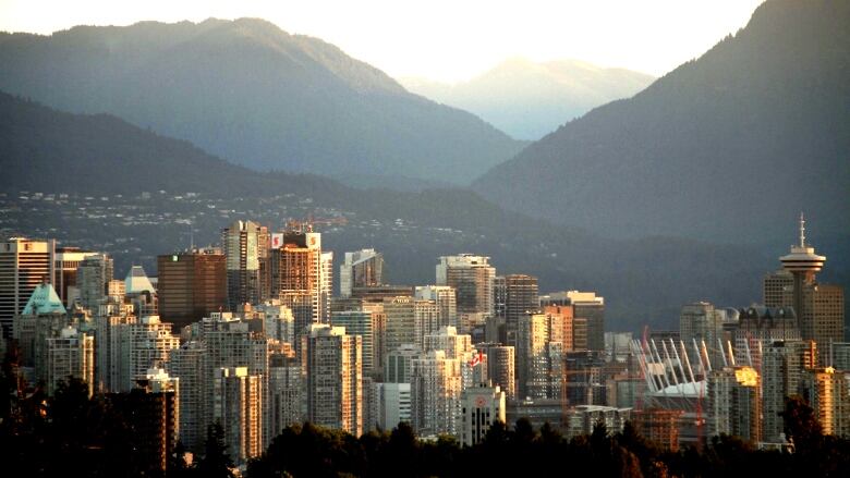 A number of skyscrapers in downtown Vancouver are pictured during sunset.