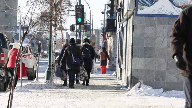 A file photo of people walking downtown Yellowknife.