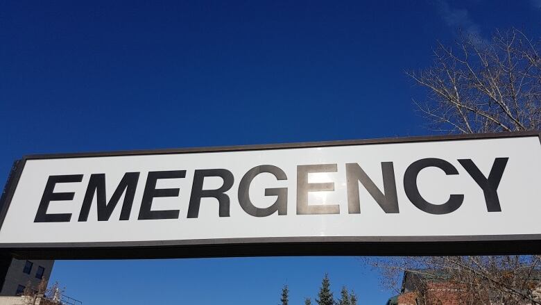 A close-up of a sign that says Emergency