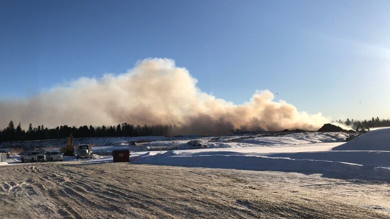 Smoke overtop of snow.