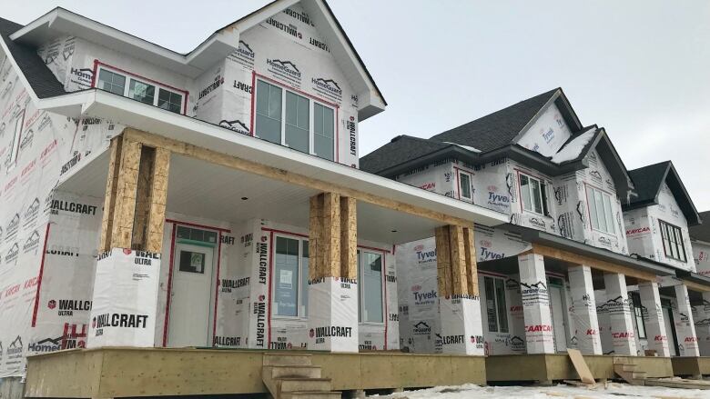 An outdoor shot of homes being built