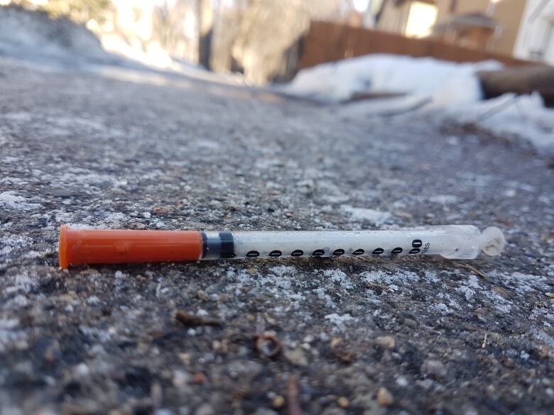 Meth need on Winnipeg West Broadway sidewalk during the winter time. 