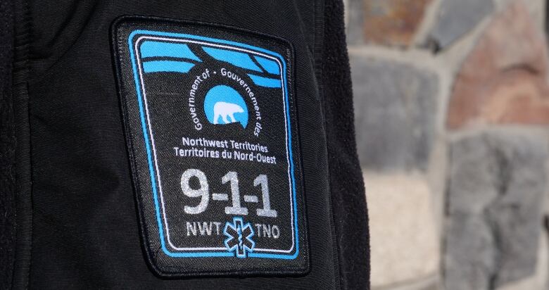 A patch that says 911 on it 