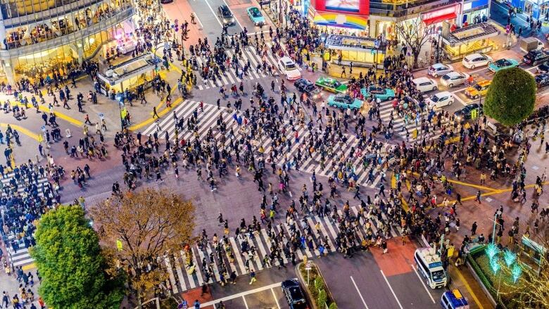 Pedestrians use the Shibuya crossing in Tokyo, Japan.