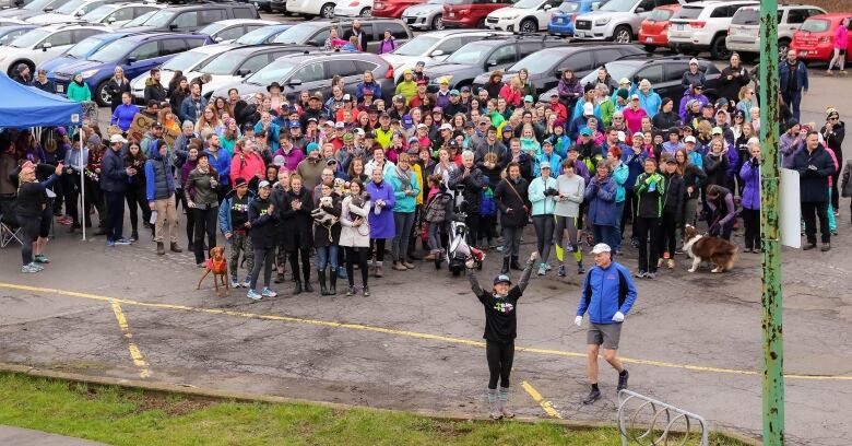 People gathered in a parking lot. 