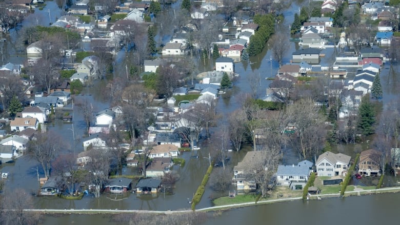 Flooded streets are seen from an aerial view in St-Marthe-sur-le-Lac, Que.