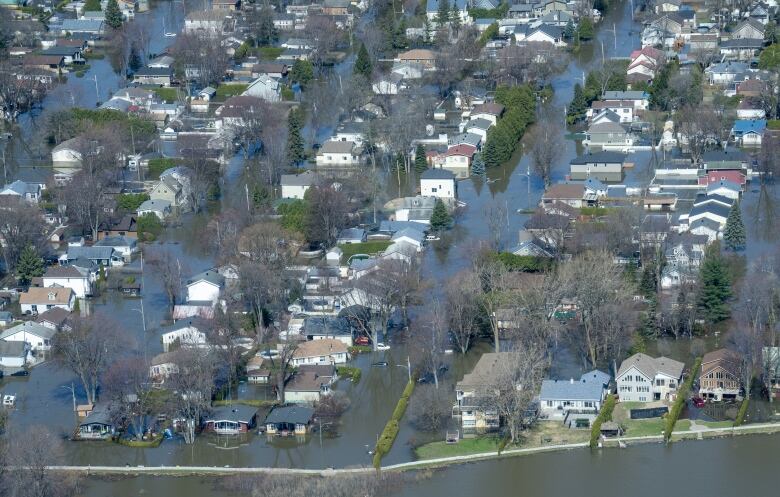 Flooded streets are seen from an aerial view in St-Marthe-sur-le-Lac, Que.