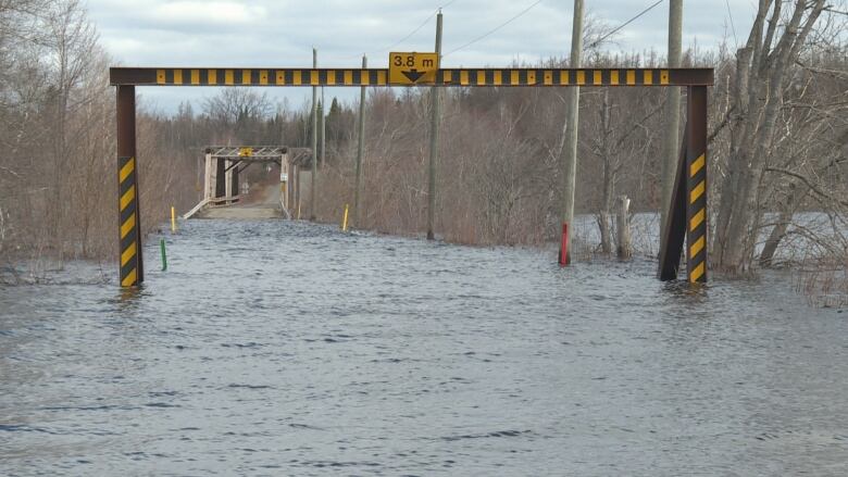 A bridge with a 3.8 metre entry point. The whole area is flooded.